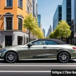 벤츠 E클래스 카브리올레의 장단점 - A luxurious Mercedes-Benz E-Class Cabriolet parked on a vibrant city street under bright daylight, s...